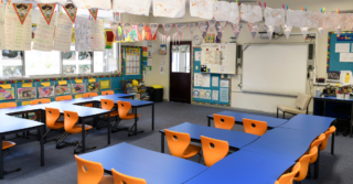 Bright classroom with lots of posters and decorations.